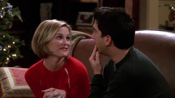 Ross and his girlfriend Mona discussing their joint Christmas card.