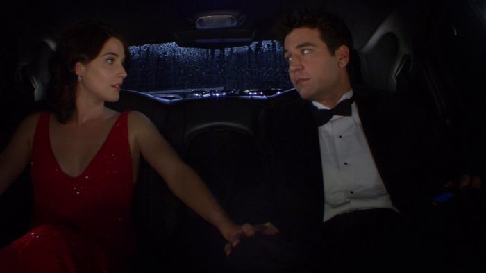 Ted Mosby and Robin Scherbatsky dressed in formal attire sitting in the back of a limousine in the "The Final Page - Part 2" episode of How I Met Your Mother.
