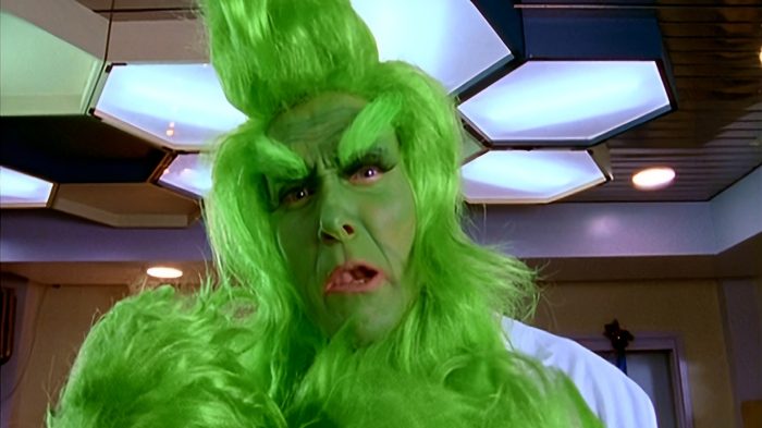Dr. Perry Cox dressed as the Grinch in a Sacred Heart hospital hallway.