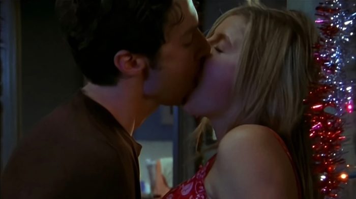 JD and Elliot sharing a passionate kiss in the apartment.